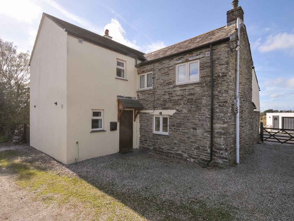 An exterior view of a house with a gravel driveway at Rosewin Farmhouse near St Minver