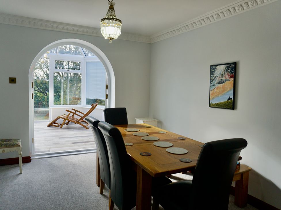 A dining room with a table and chairs at The Peak View Holmfirth