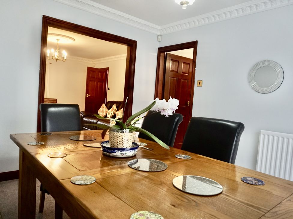 A dining room with a table and chairs at The Peak View Holmfirth