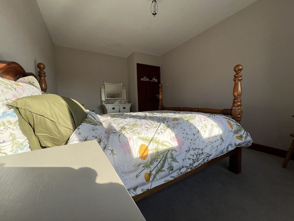 A bedroom with a bed and a mirror at The Peak View Holmfirth