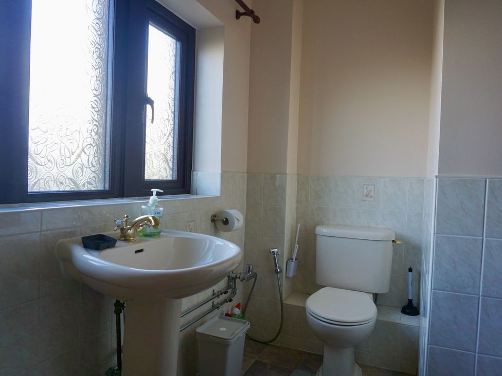 A bathroom with a sink and toilet at The Peak View Holmfirth