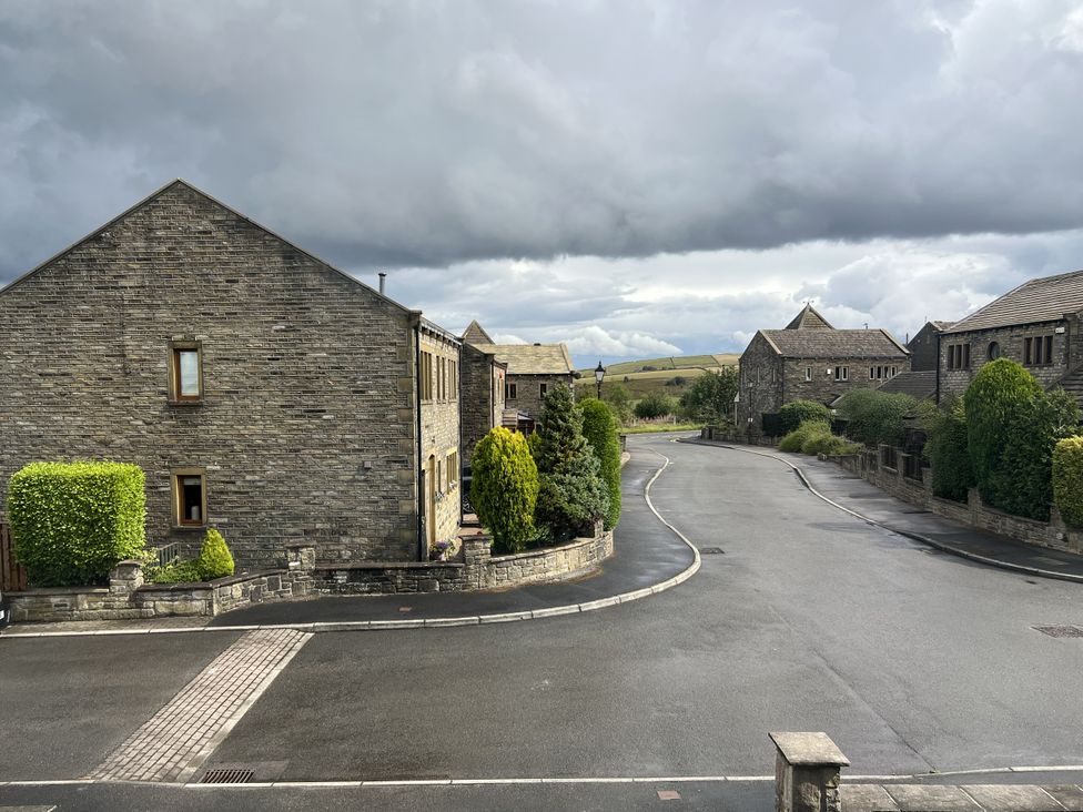 A residential area with houses and a road at The Peak View Holmfirth