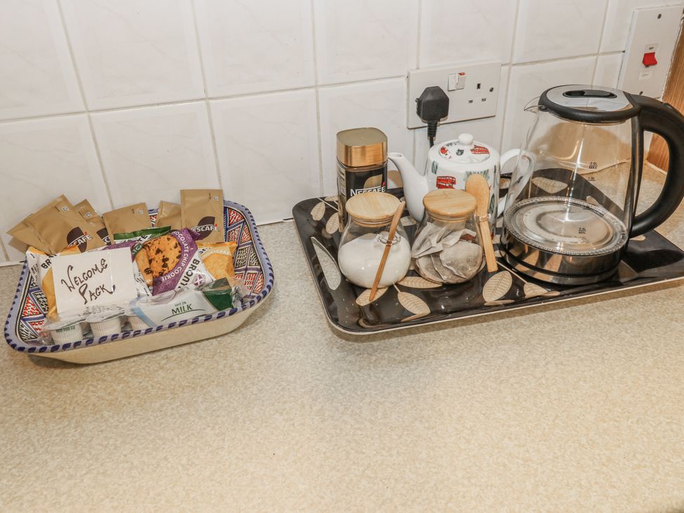 A kitchen setup with tea and coffee supplies at The Peak View Holmfirth
