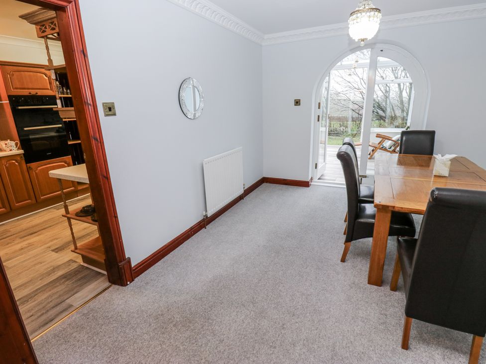 A dining room with a table and chairs at The Peak View Holmfirth Hade Edge Yorkshire
