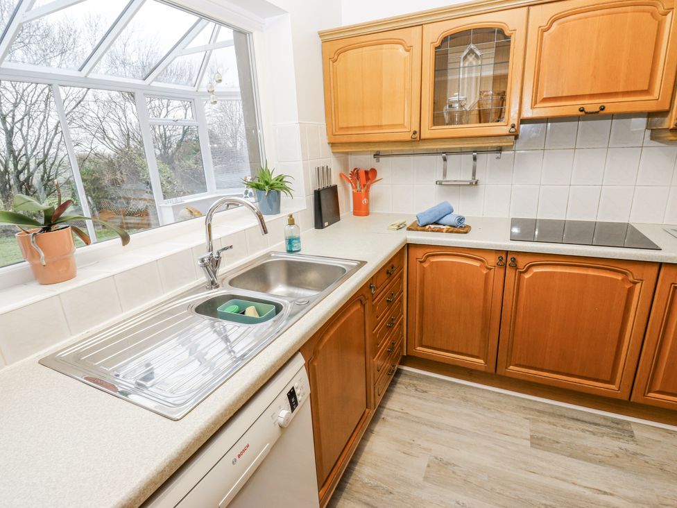 A kitchen with a sink and cabinets at The Peak View Holmfirth in Hade Edge, Yorkshire
