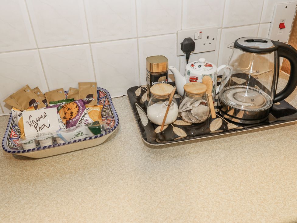 A kettle and tray with coffee sachets and tea accessories at The Peak View Holmfirth Hade Edge, Yorkshire
