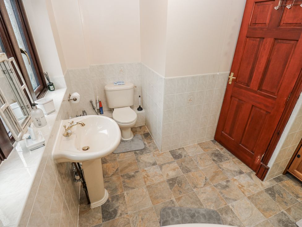 A bathroom with a sink and toilet at The Peak View Holmfirth Hade Edge Yorkshire