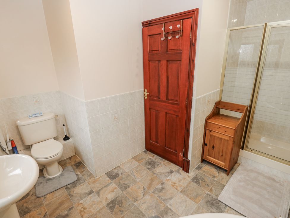 A bathroom with a toilet, sink, and shower at The Peak View Holmfirth, Hade Edge, Yorkshire