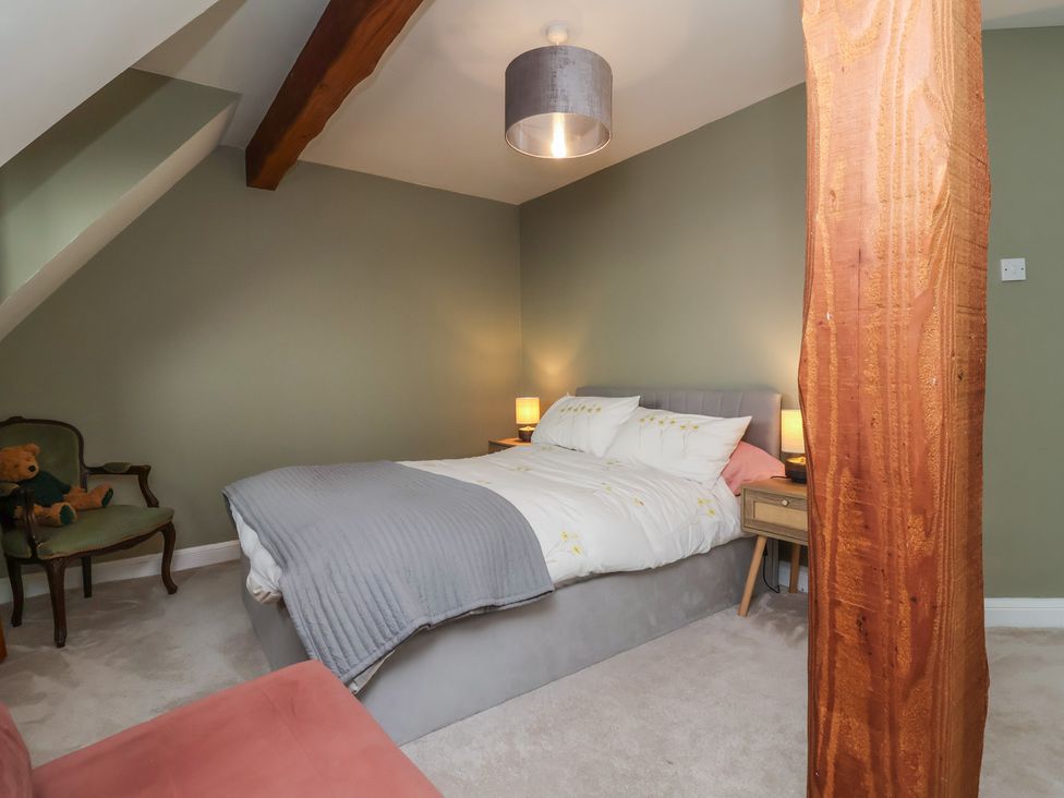 A bedroom with a bed and bedside table at Hedgerose in Goodleigh near Barnstaple