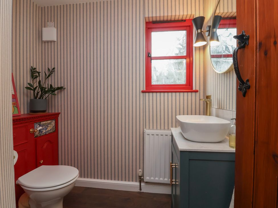A bathroom with a sink and toilet at Hedgerose in Goodleigh near Barnstaple