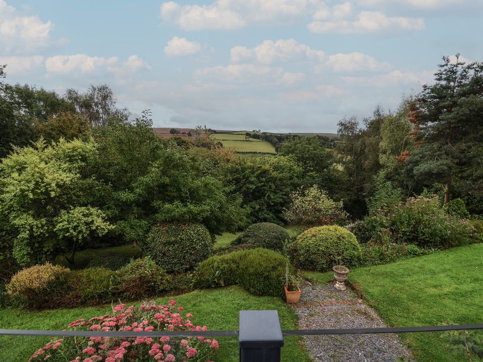 A garden with greenery and a view at Hedgerose in Goodleigh near Barnstaple