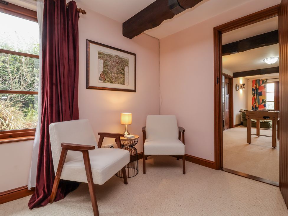 A snug with two chairs and a lamp at Hedgerose in Goodleigh near Barnstaple