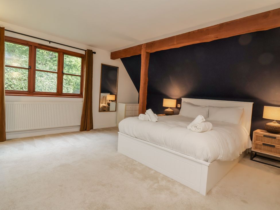 A bedroom with a bed and lamps at Hedgerose Goodleigh near Barnstaple