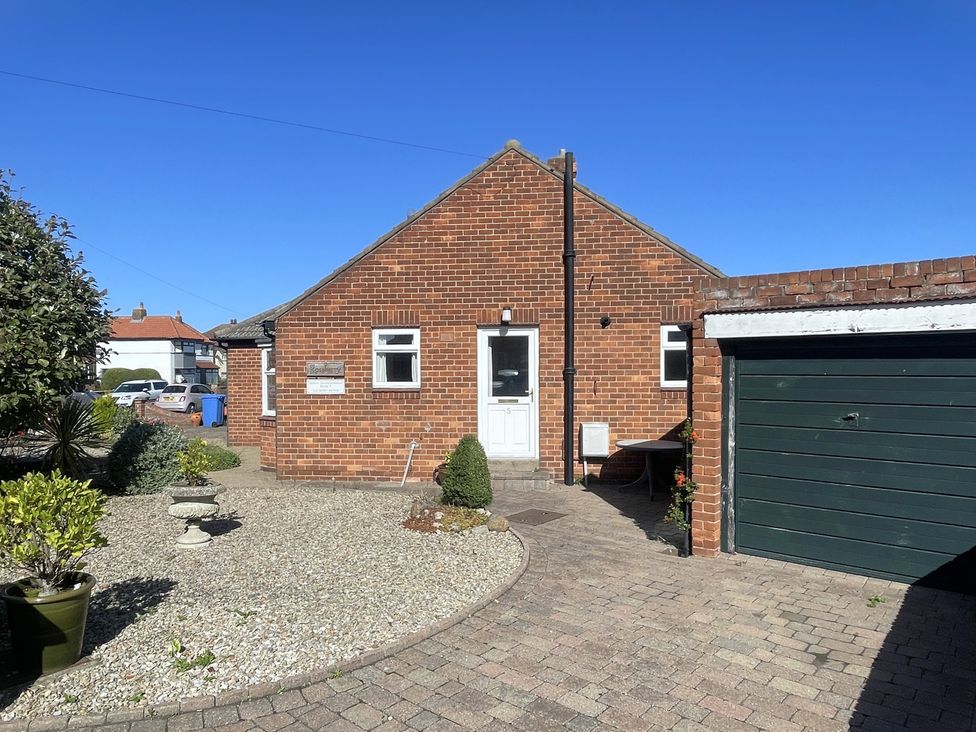A house with a garage and garden at Roseberry in Whitby