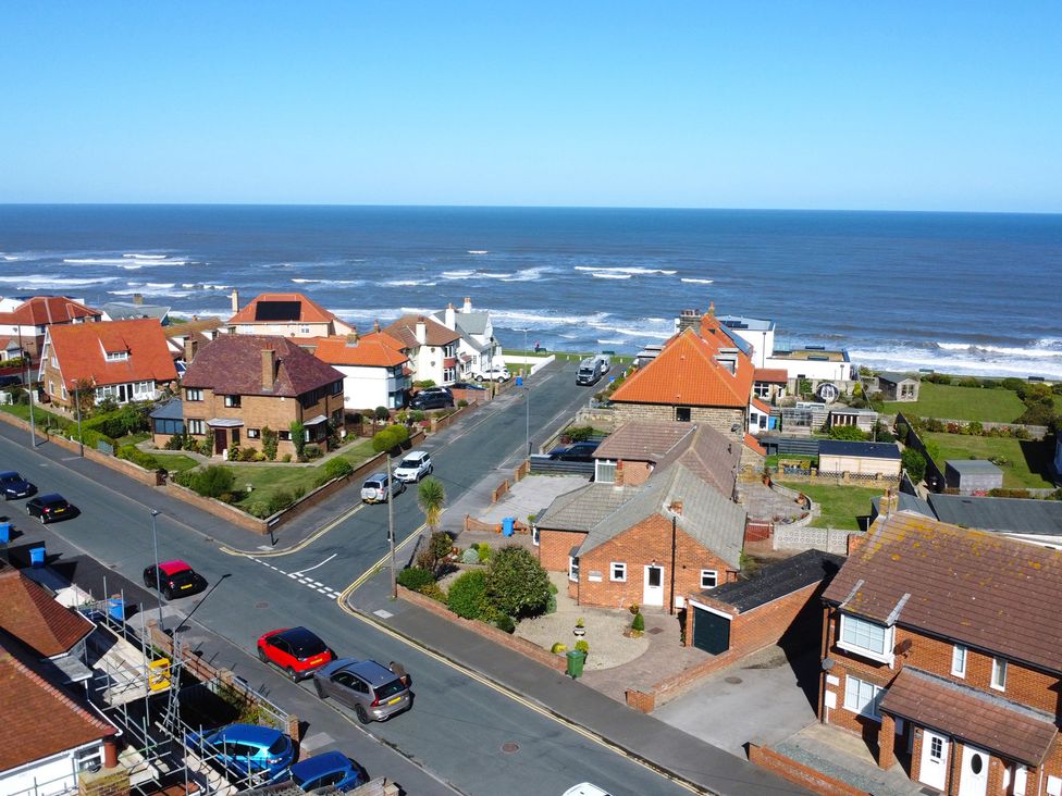 A street with houses and ocean view at Roseberry in Whitby