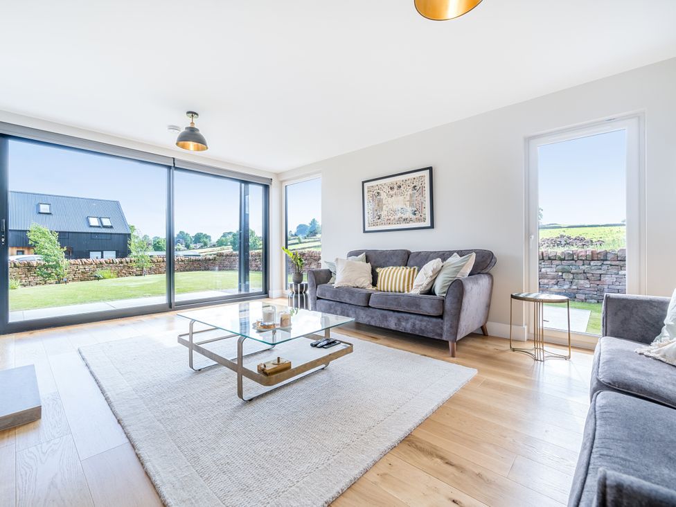 A living room with a sofa and coffee table at The Old Barn in Manchester