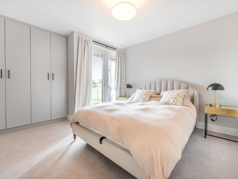 A bedroom with a bed and wardrobe at the property in location