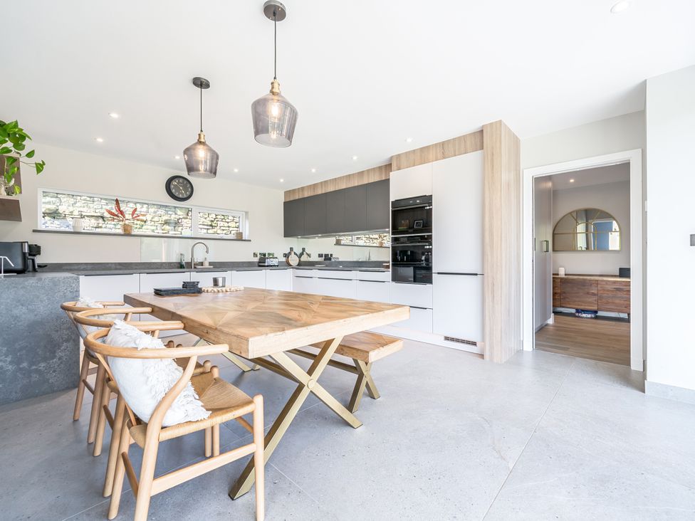 A kitchen with a table and chairs at 3 Fallow Gardens in Great Salkeld near Lazonby