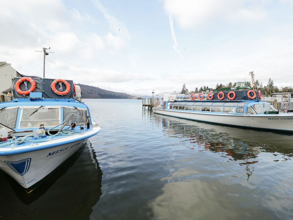 Two boats with life rings on a lake at Easedale Lodge, Waterside Wood 2, White Cross Bay near Windermere