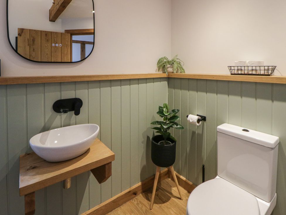A bathroom with a sink and toilet at Eleri’s Barn Nantmel near Rhayader