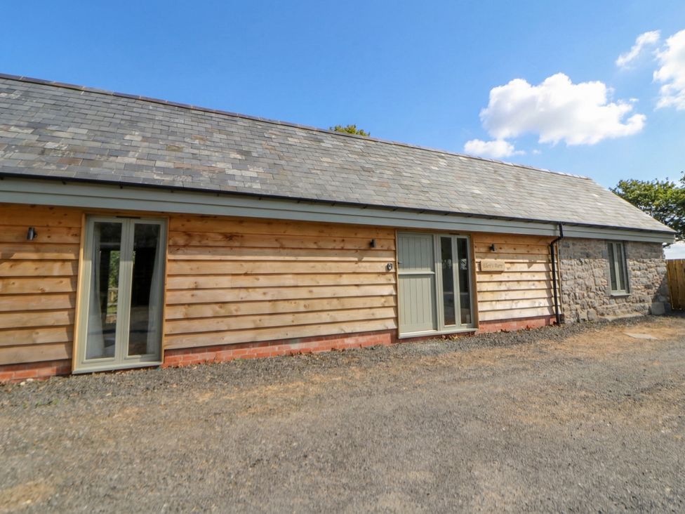 An exterior view of a wooden house at Eleri’s Barn in Nantmel near Rhayader