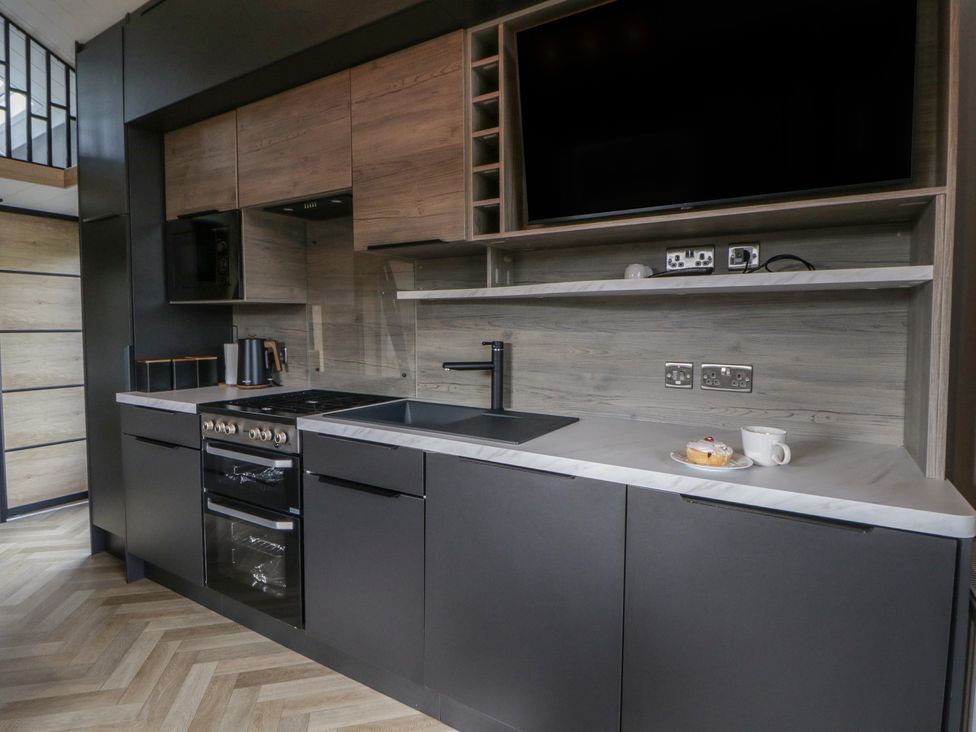 A kitchen with cabinets and countertop at Daverneithon 1 Near Llandrindod Wells