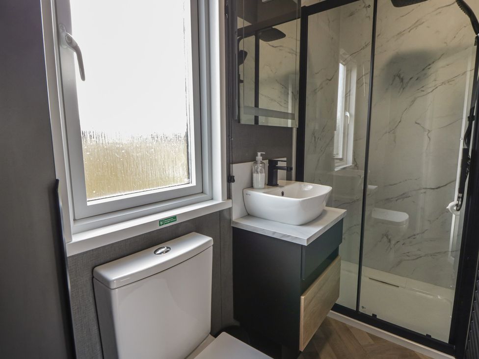 A bathroom with a sink and shower at Daverneithon 2 near Llandrindod Wells