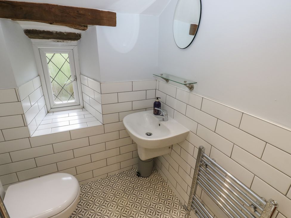 A bathroom with a sink and toilet at 11 Hollin Well Cottage Sowerby Bridge