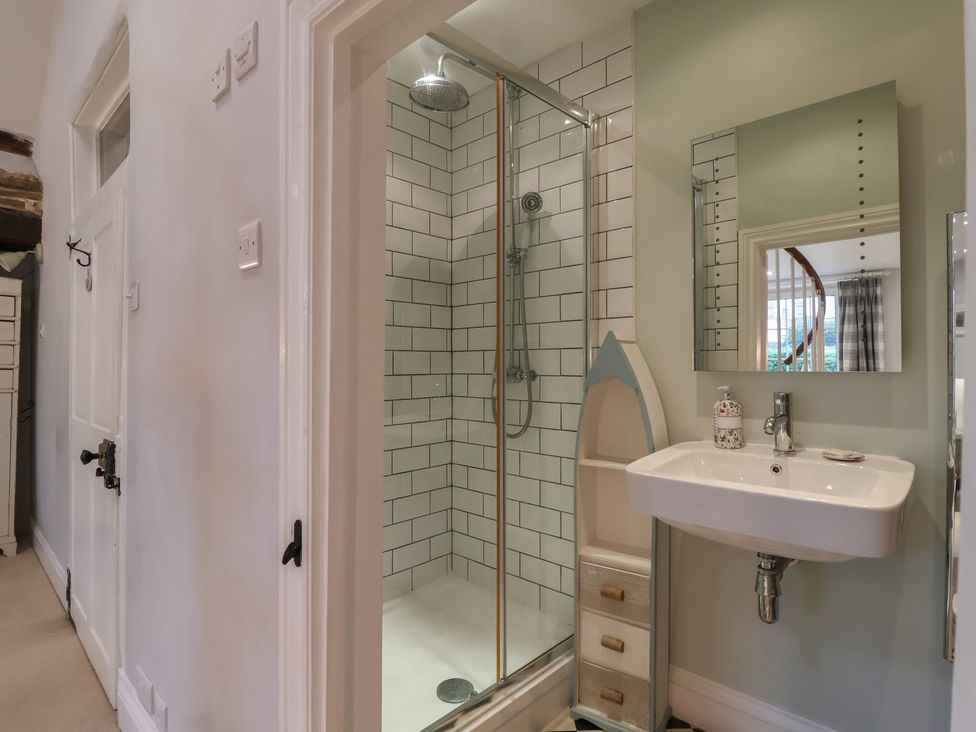 A bathroom with a shower and sink at The Old Manor House in Lifton