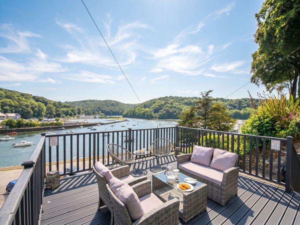 An outdoor seating area overlooking a river at Overdale