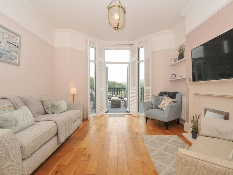 A living room with a sofa and armchair at Overdale