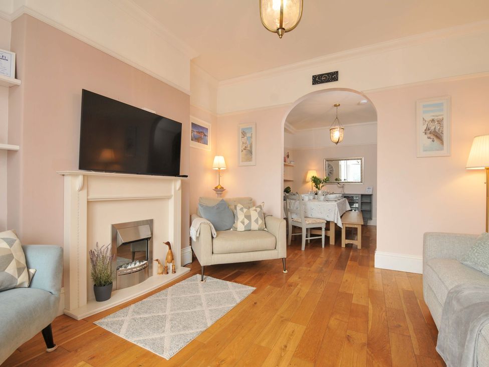 A living room with a television and fireplace at Overdale