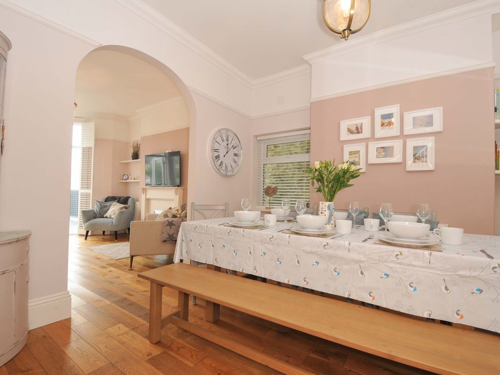 A dining room with a table set for a meal at Overdale
