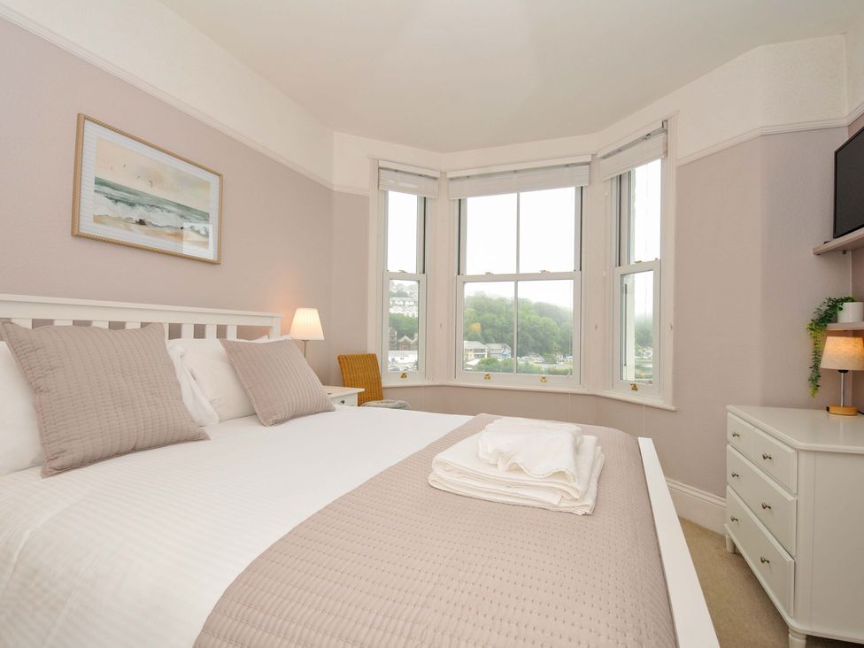 A bedroom with a bed and a dresser at Overdale