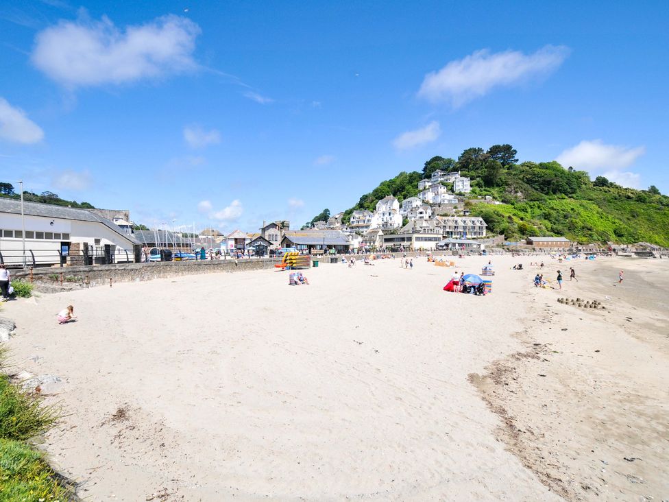 A beach with people and buildings at Overdale