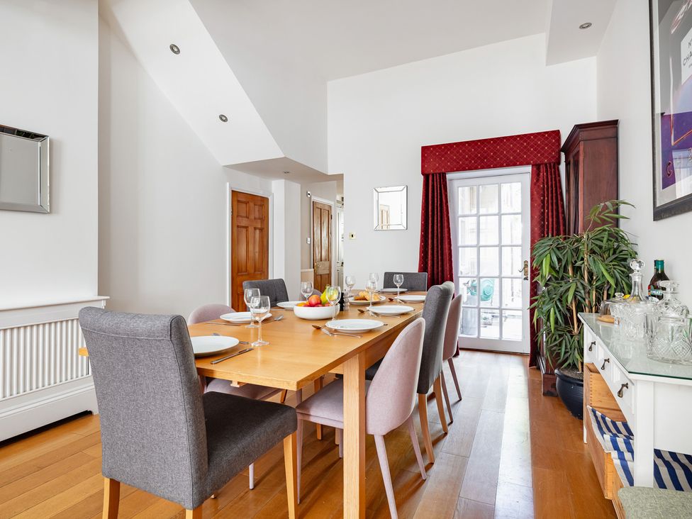 A dining room with a table and chairs at Castle View in Windsor, Berkshire