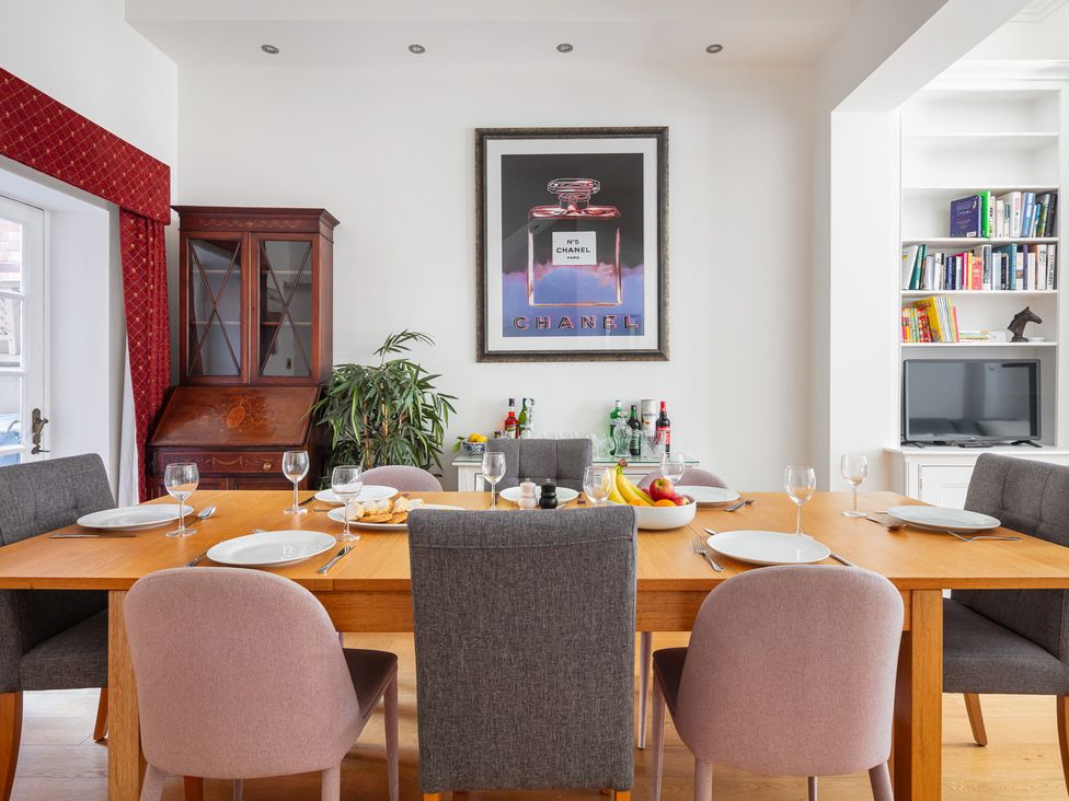 A dining room with a table and chairs at Castle View, Windsor, Berkshire