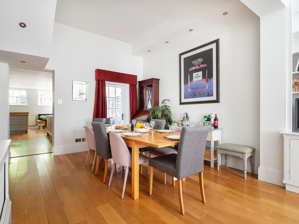 A dining room with a table and chairs at Castle View in Windsor, Berkshire