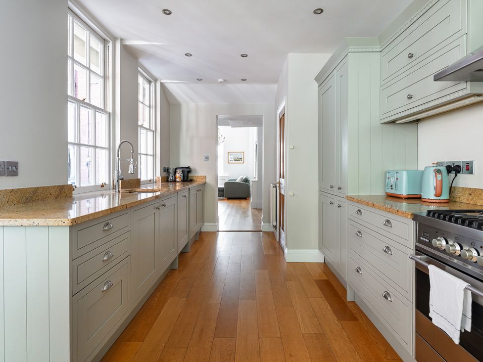 A kitchen with cabinets and countertop at Castle View in Windsor, Berkshire