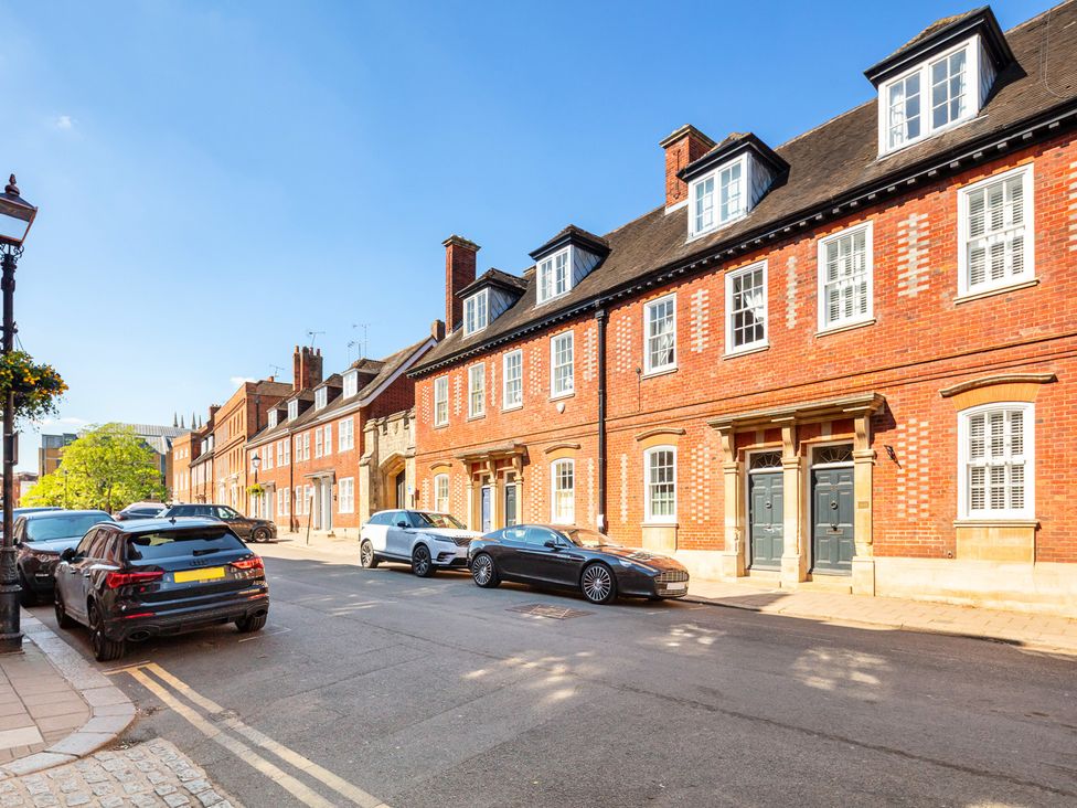 A street with parked cars and historical buildings at Castle View in Windsor, Berkshire