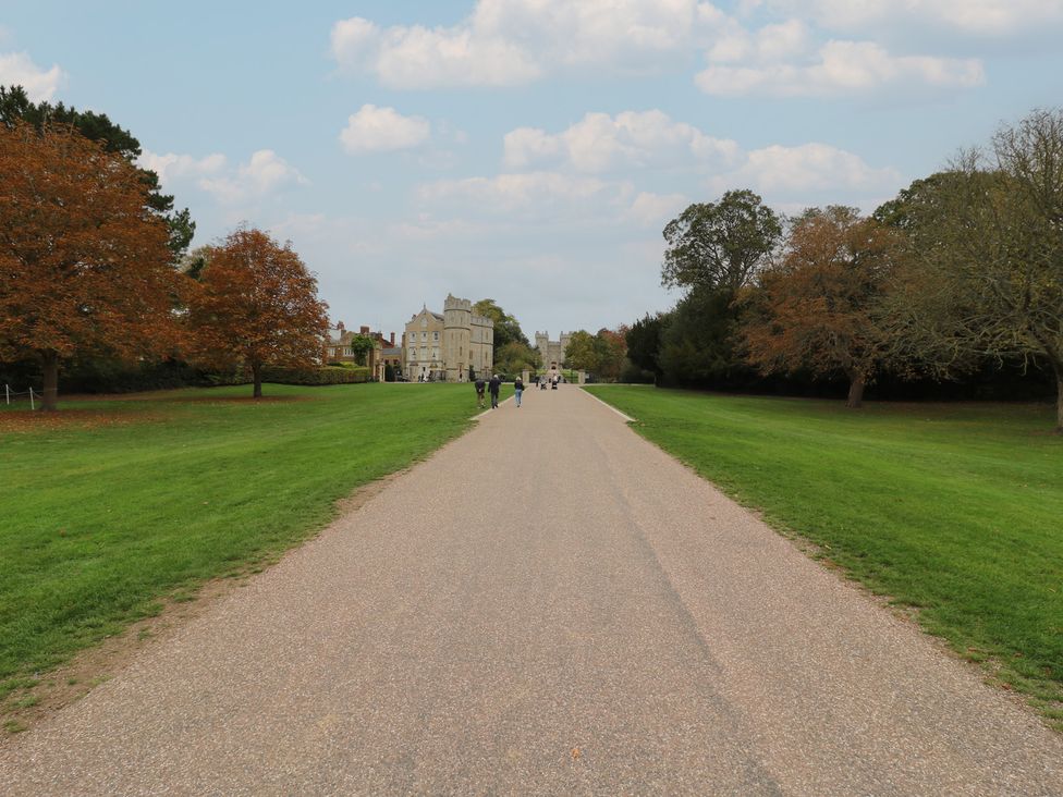 A view of a pathway with trees and buildings at Castle View in Windsor, Berkshire