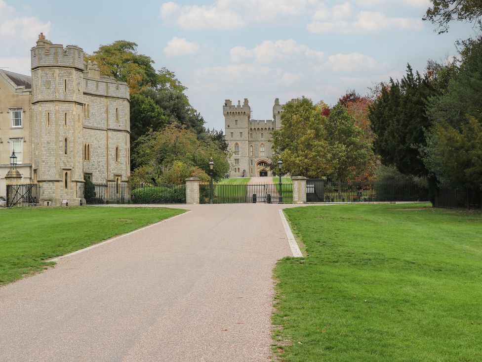 A castle with a large gate and trees at Castle View in Windsor, Berkshire