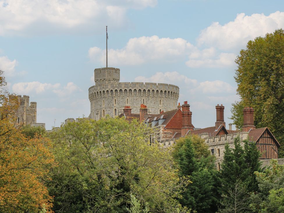 A view of a castle with trees and clouds at Castle View in Windsor, Berkshire