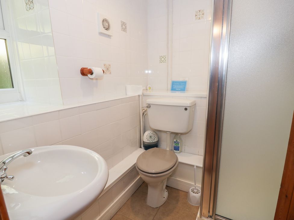 A bathroom featuring a sink, toilet, and shower at Ysgoldy, Dolwyddelan