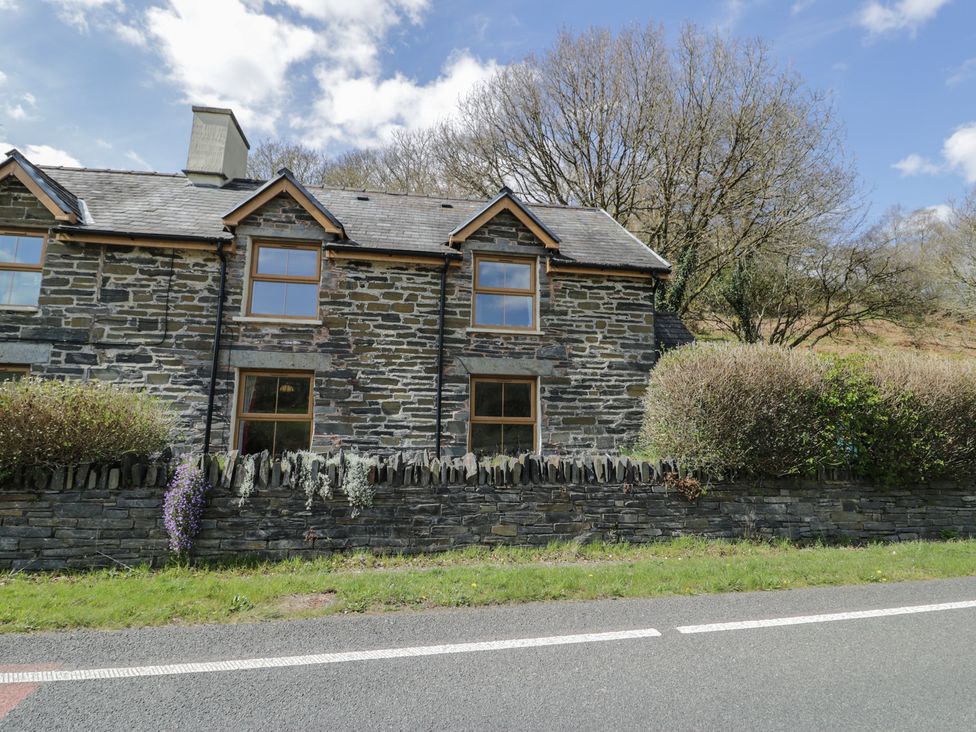 A house with stone walls and windows at Ysgoldy in Dolwyddelan