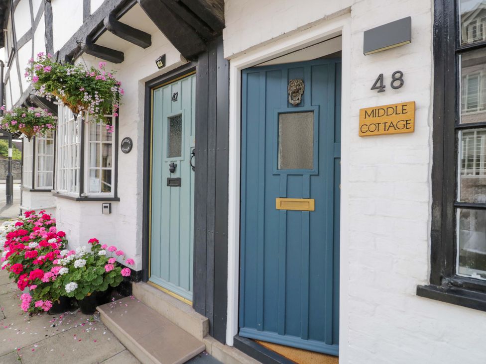 A house entrance with doors and flowers at Middle Cottage in Ludlow