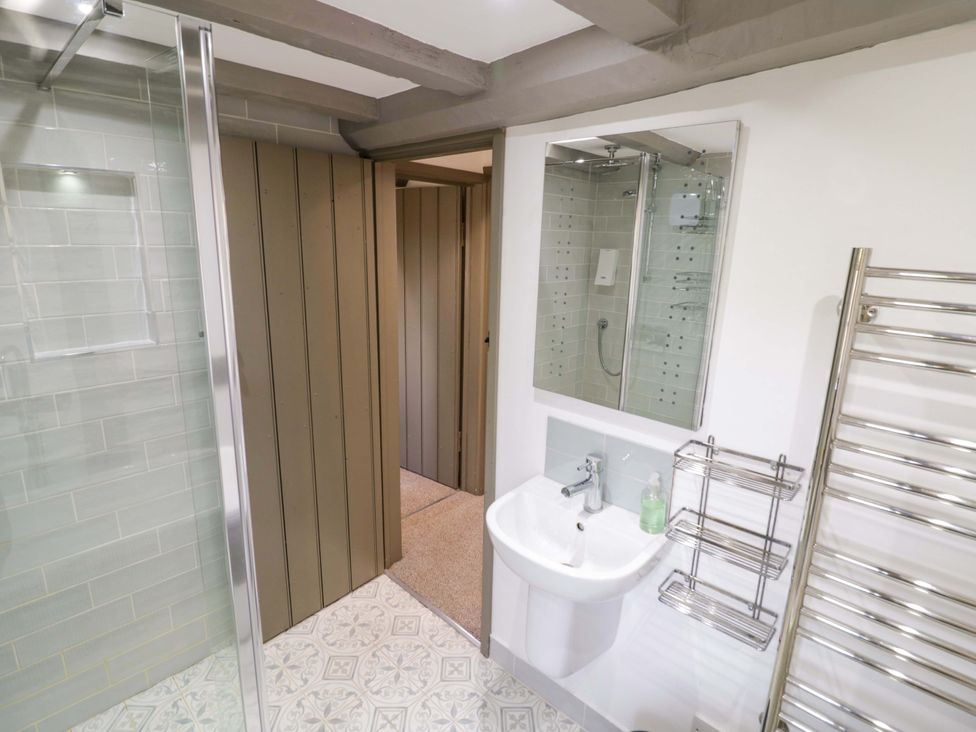 A bathroom with a shower and sink at Middle Cottage in Ludlow