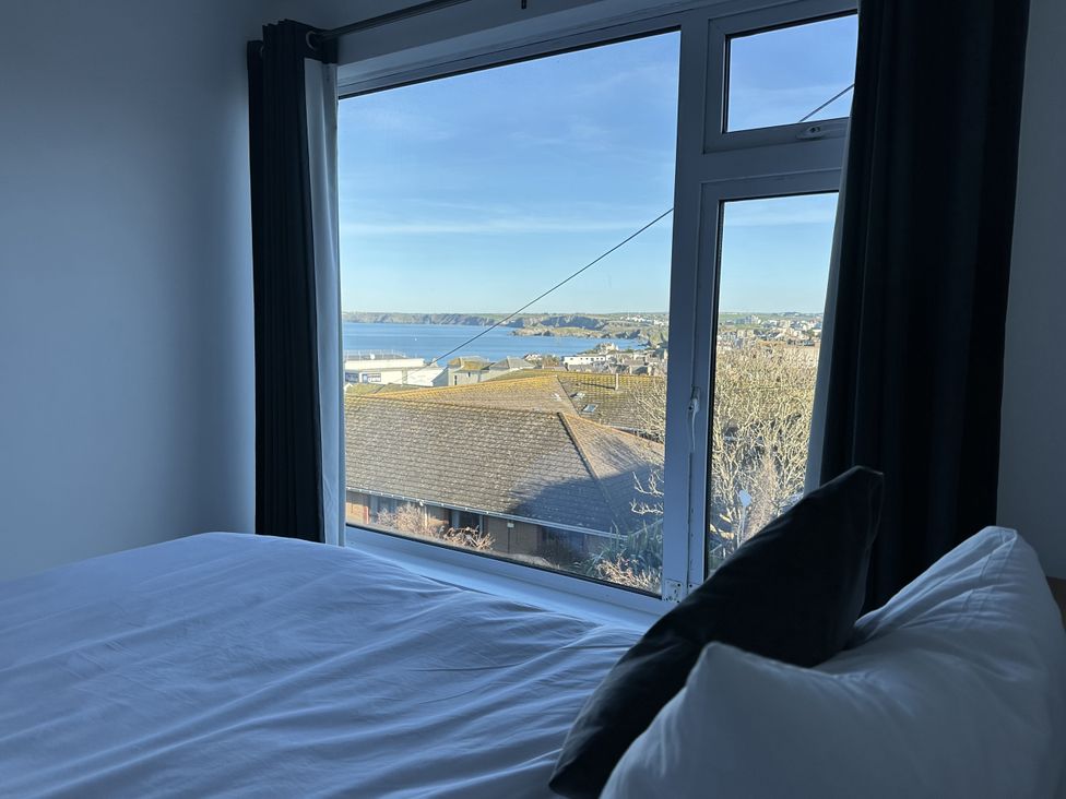 A bedroom with a view of the sea at Sea Boots in Newquay