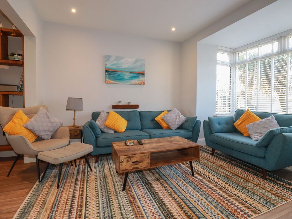 A living room with sofas and a coffee table at Sea Boots in Newquay