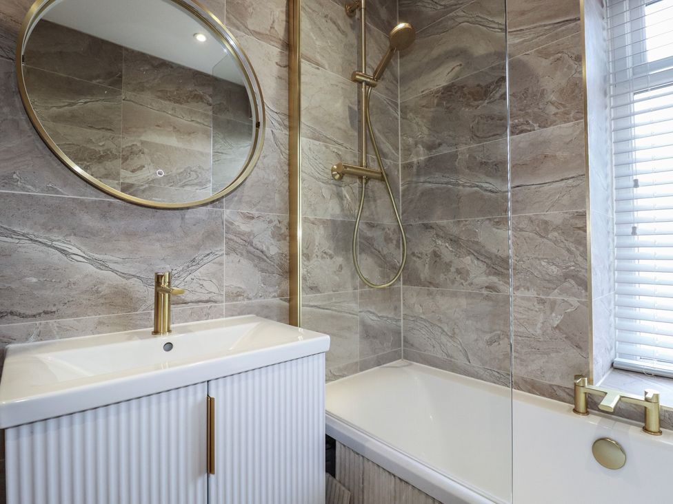 A bathroom with a bathtub and sink at Sea Boots in Newquay